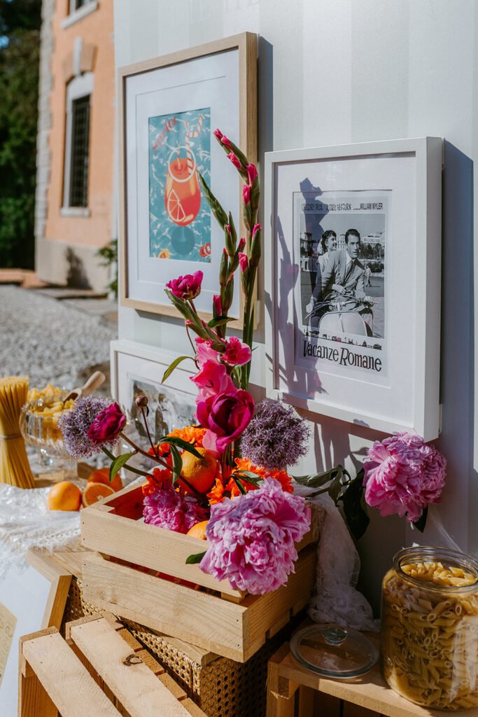 Italian-inspired wedding welcome styling with flowers, citrus and vintage prints