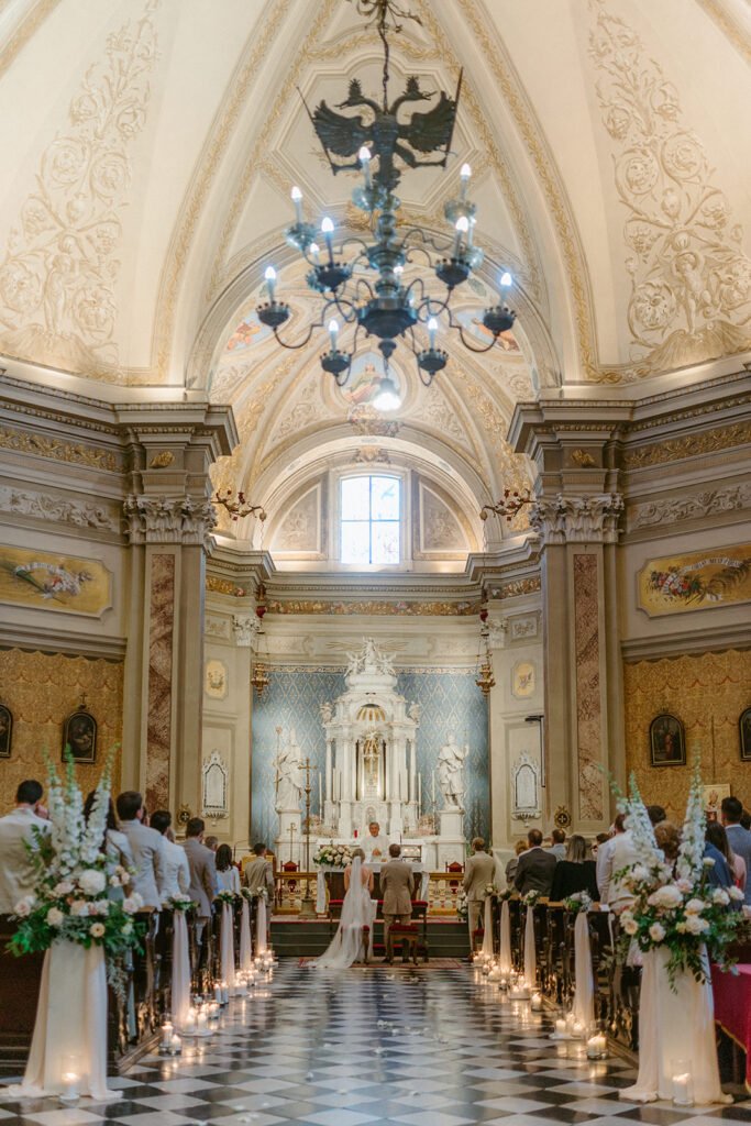 Bride and groom exchanging vows during the wedding ceremony in a historic Italian church