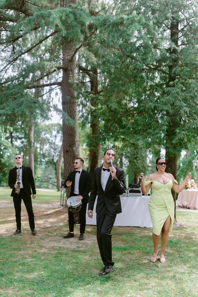 Live wedding band performing during the outdoor aperitivo at Castello di Spessa