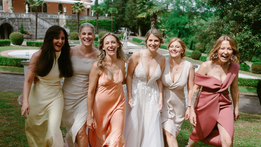Bride celebrating with her bridesmaids before the wedding reception