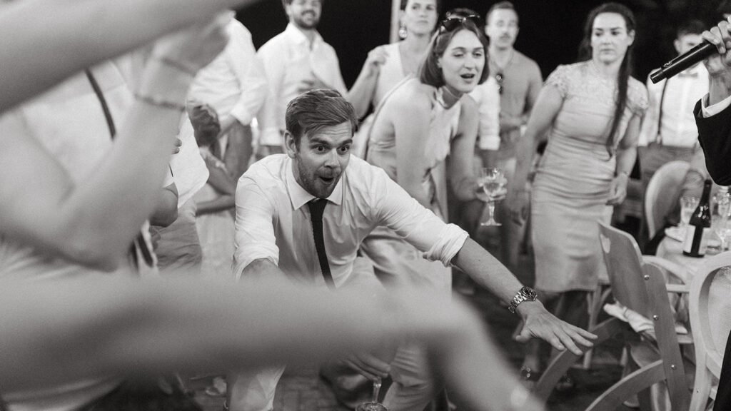 Wedding guests dancing and celebrating during the evening party